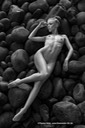 Model Mette Munkø Lying nude on rounded rocks TH2013-1129. Foto/Photo: Thomas Holm